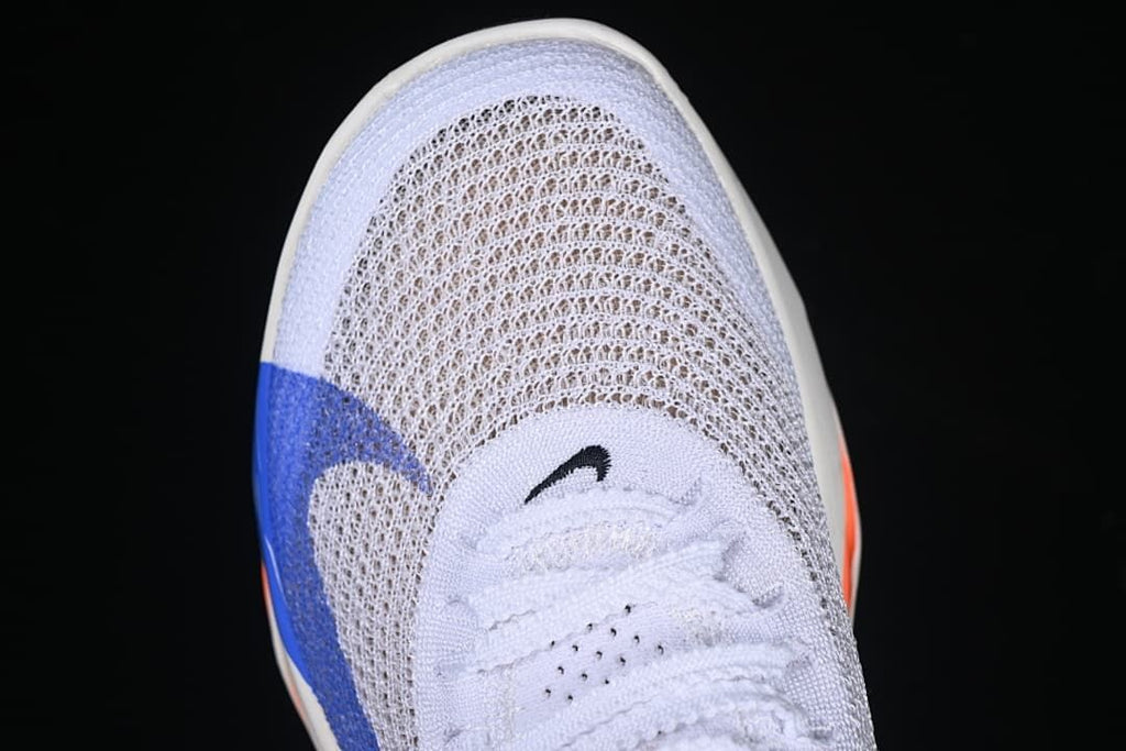 Top-down close-up of the white laces and knit-style toe