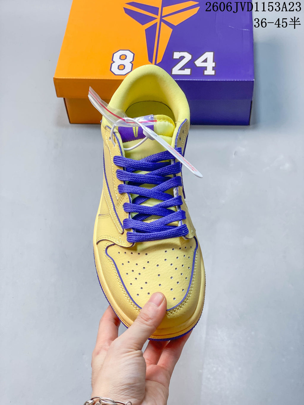 Top view highlighting the perforated toe and purple laces