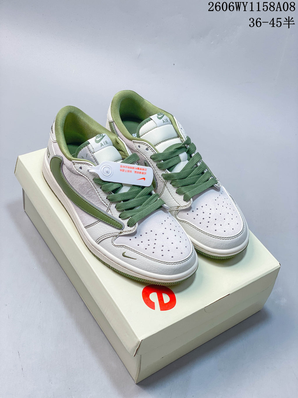 Pair of off-white and green low-top sneakers shown on a box
