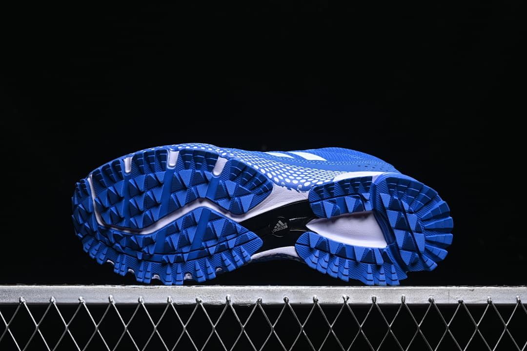 Underside view showing the lugged blue outsole tread
