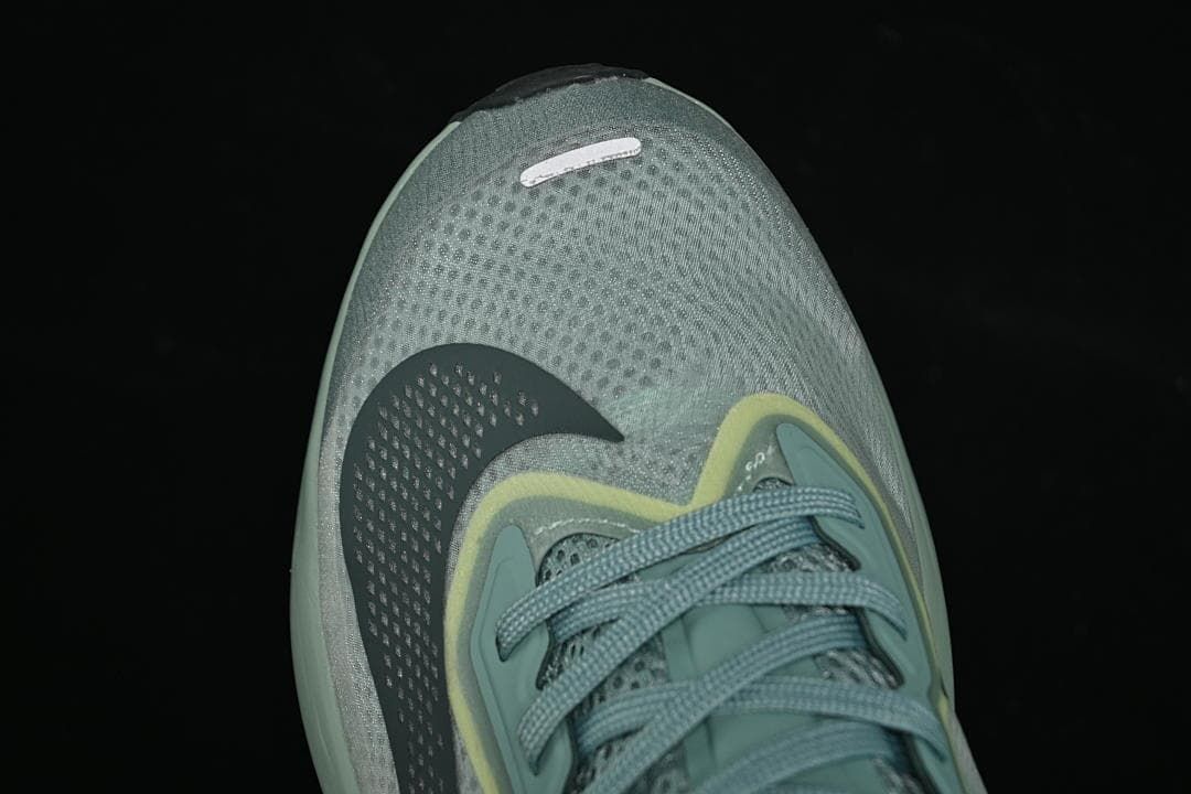 Top view of mesh toe box, laces, and Swoosh