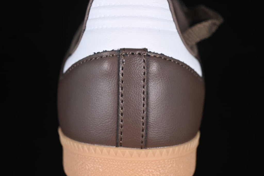 Rear view of the brown sneaker with white heel panel and gum outsole