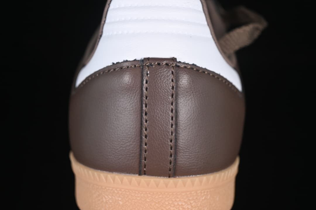 Rear view of the brown sneaker with white heel panel and gum outsole