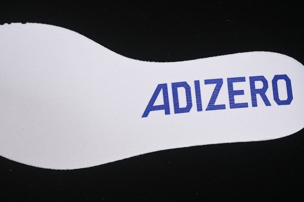 Close-up of Adizero text on the white insole.