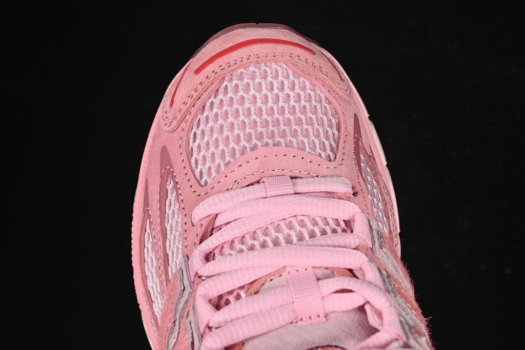 Top view of the mesh toe and pink lace-up front.