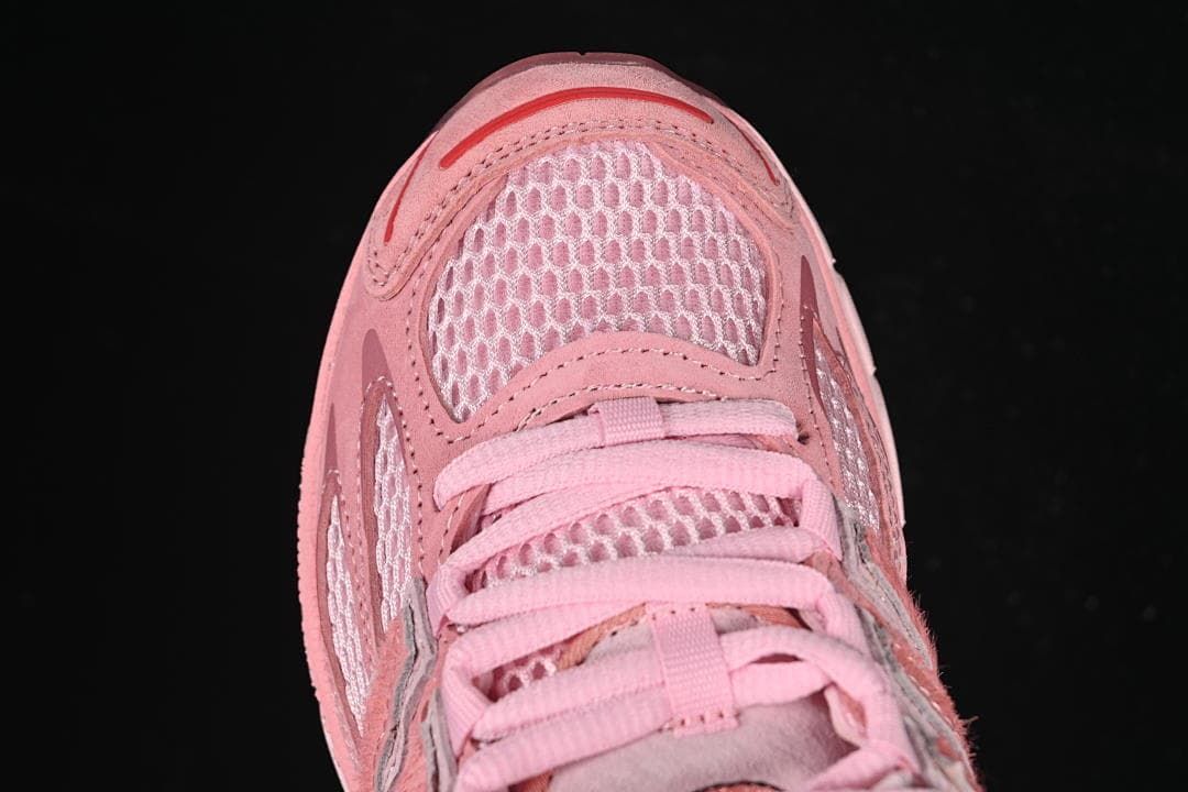 Top view of the mesh toe and pink lace-up front.
