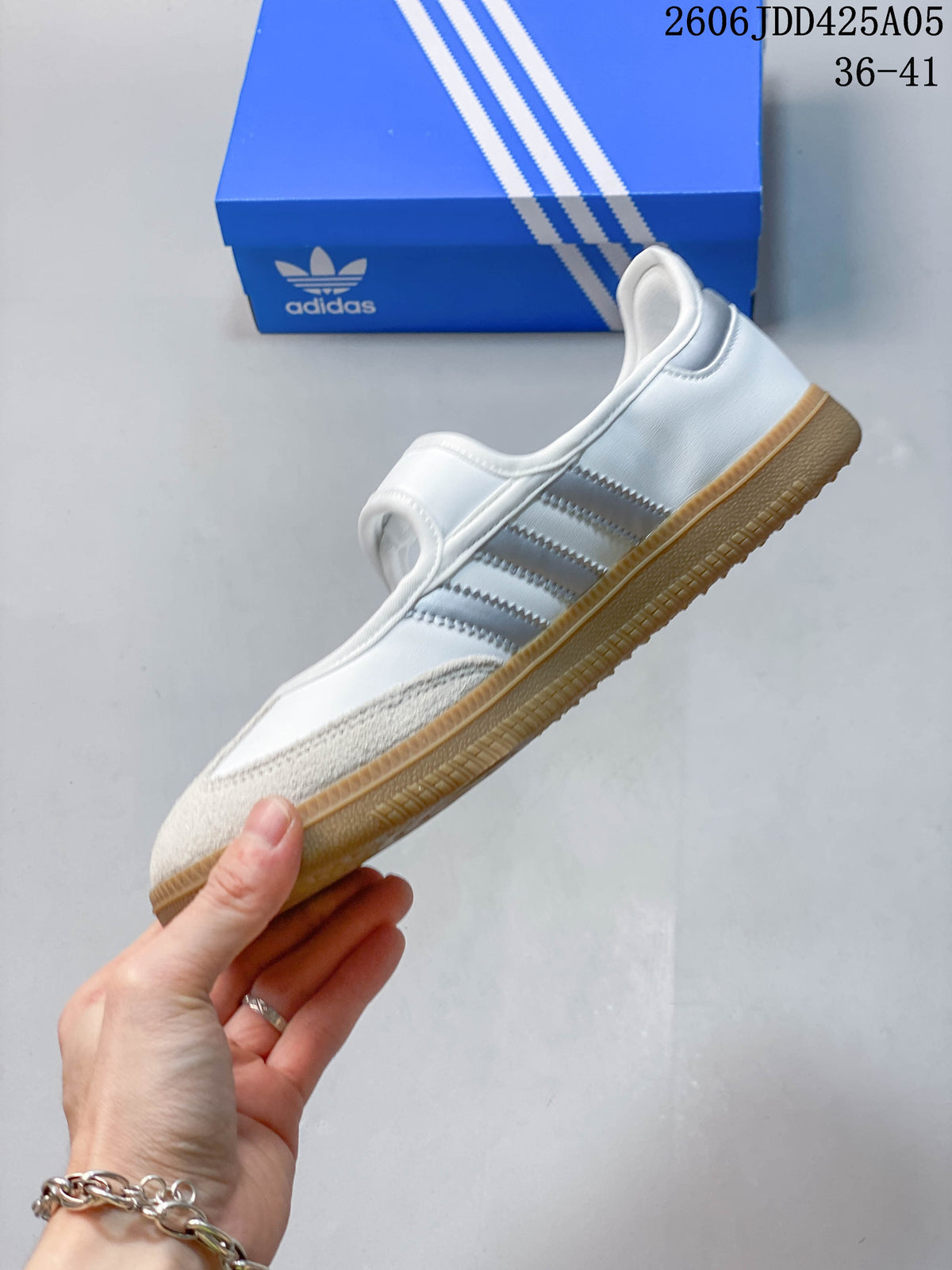 Side view showing the stripes, strap, and gum-colored outsole