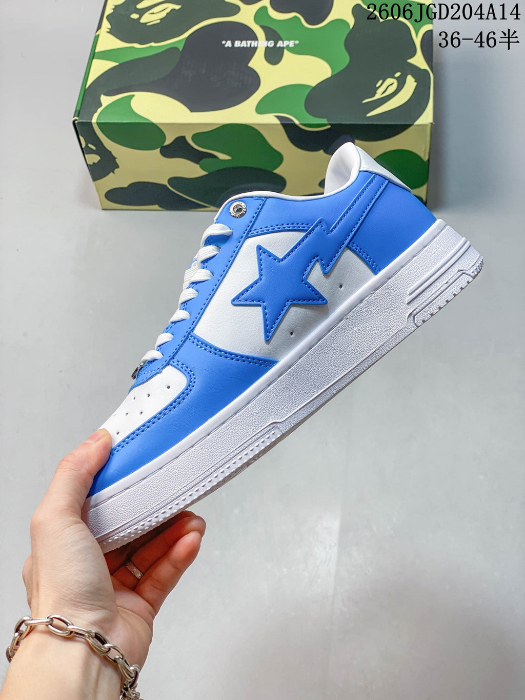 Side view showing the blue star-shaped detail on the white sneaker upper