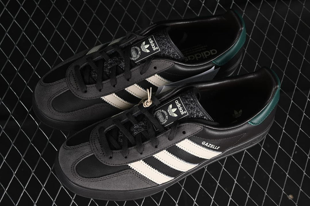 Pair of black Gazelle Indoor sneakers shown from above at an angle