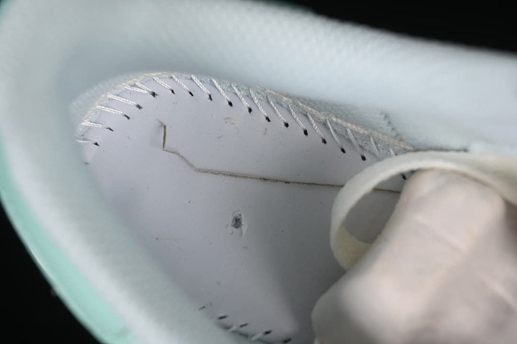 Interior close-up showing stitching beneath the shoe lining