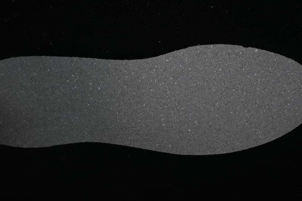 Close-up view of a dark gray shoe insole.