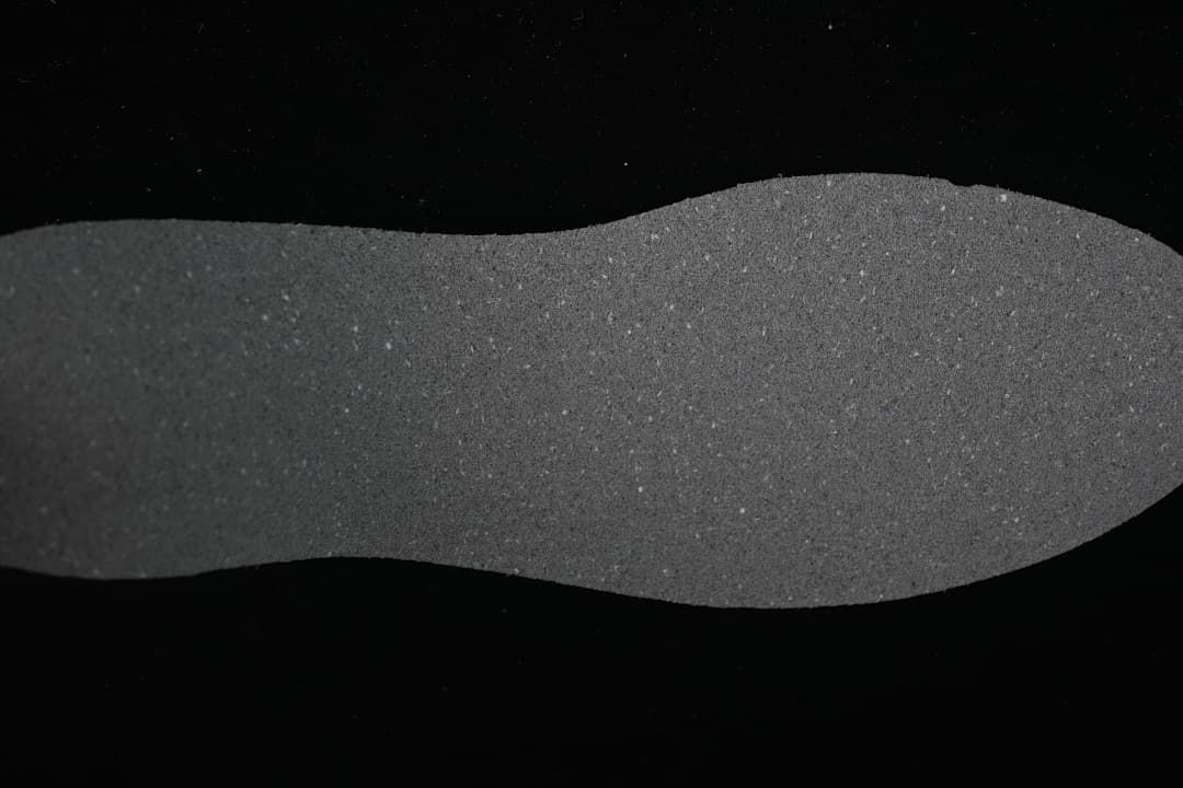 Close-up view of a dark gray shoe insole.