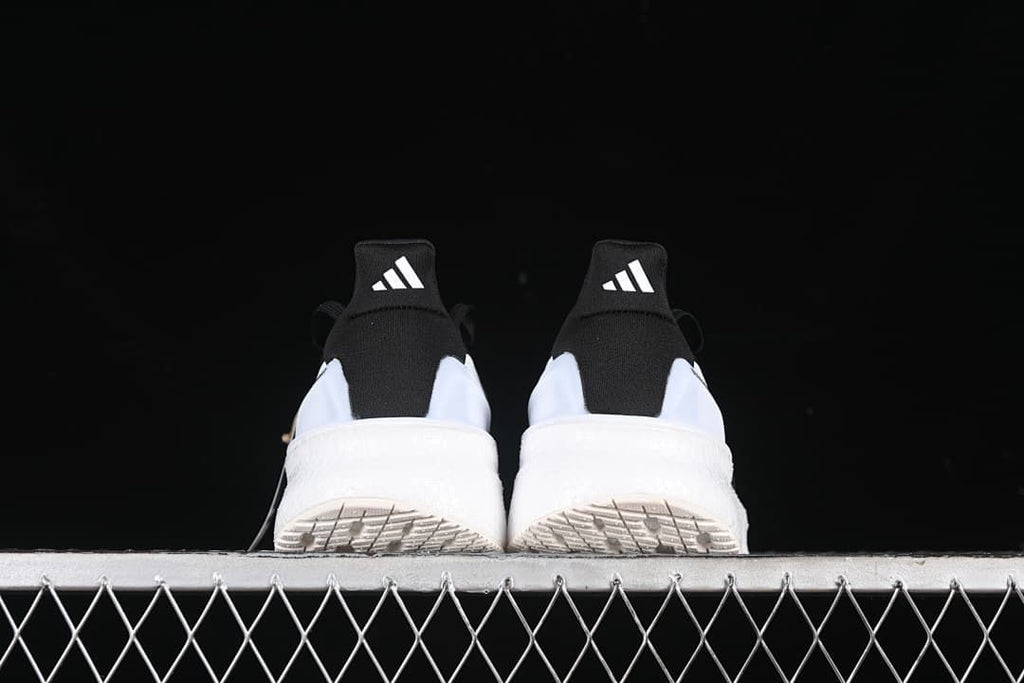 Rear view of the pair showing heel tabs and outsoles