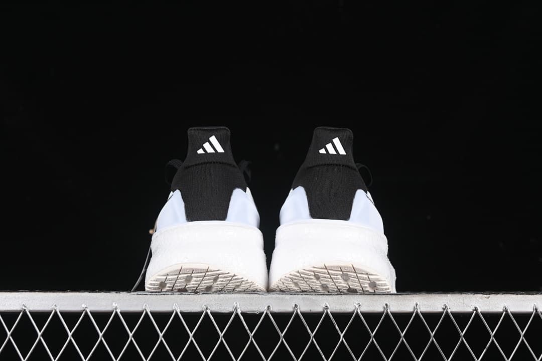 Rear view of the pair showing heel tabs and outsoles