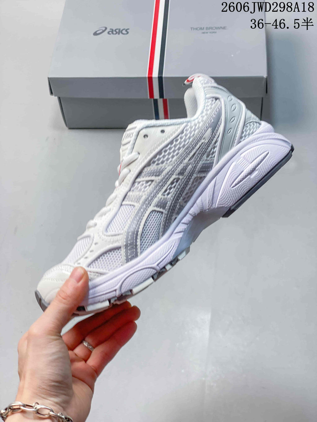 Side view of the white and silver-gray ASICS GT-2160 sneaker