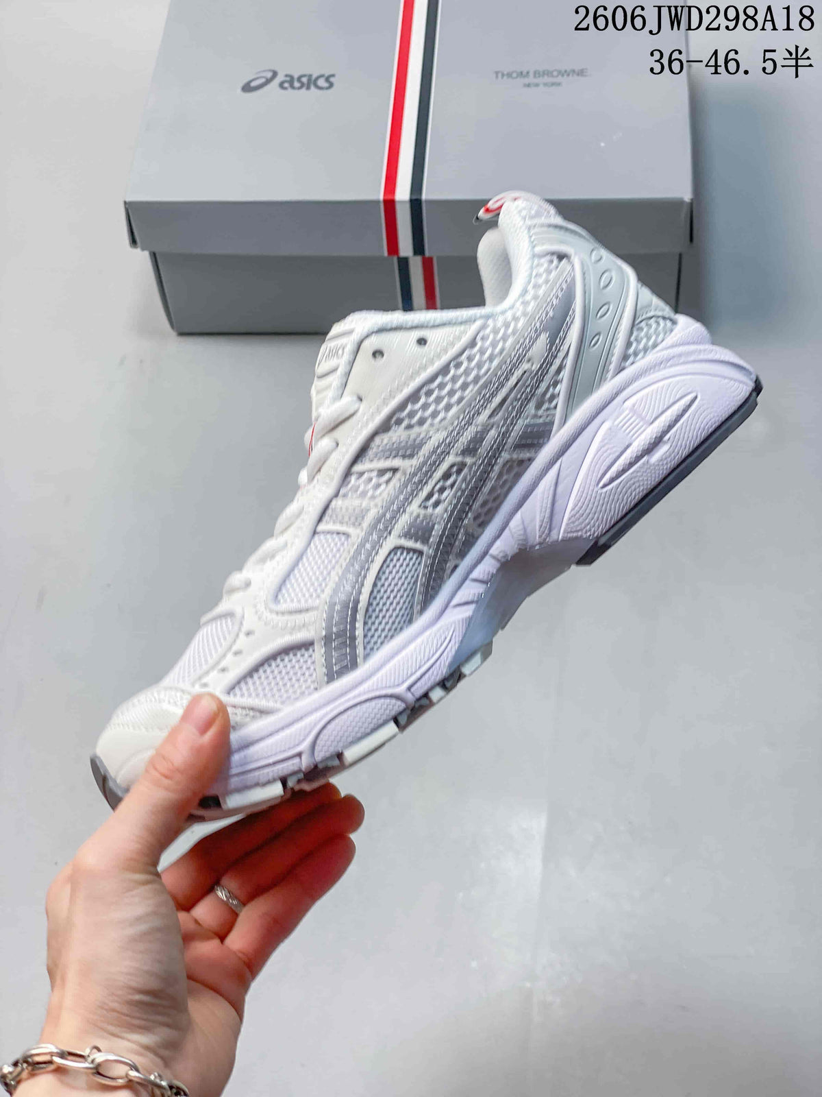 Side view of the white and silver-gray ASICS GT-2160 sneaker