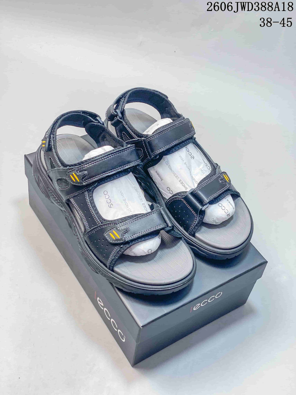 Pair of gray sandals with adjustable straps shown from above.