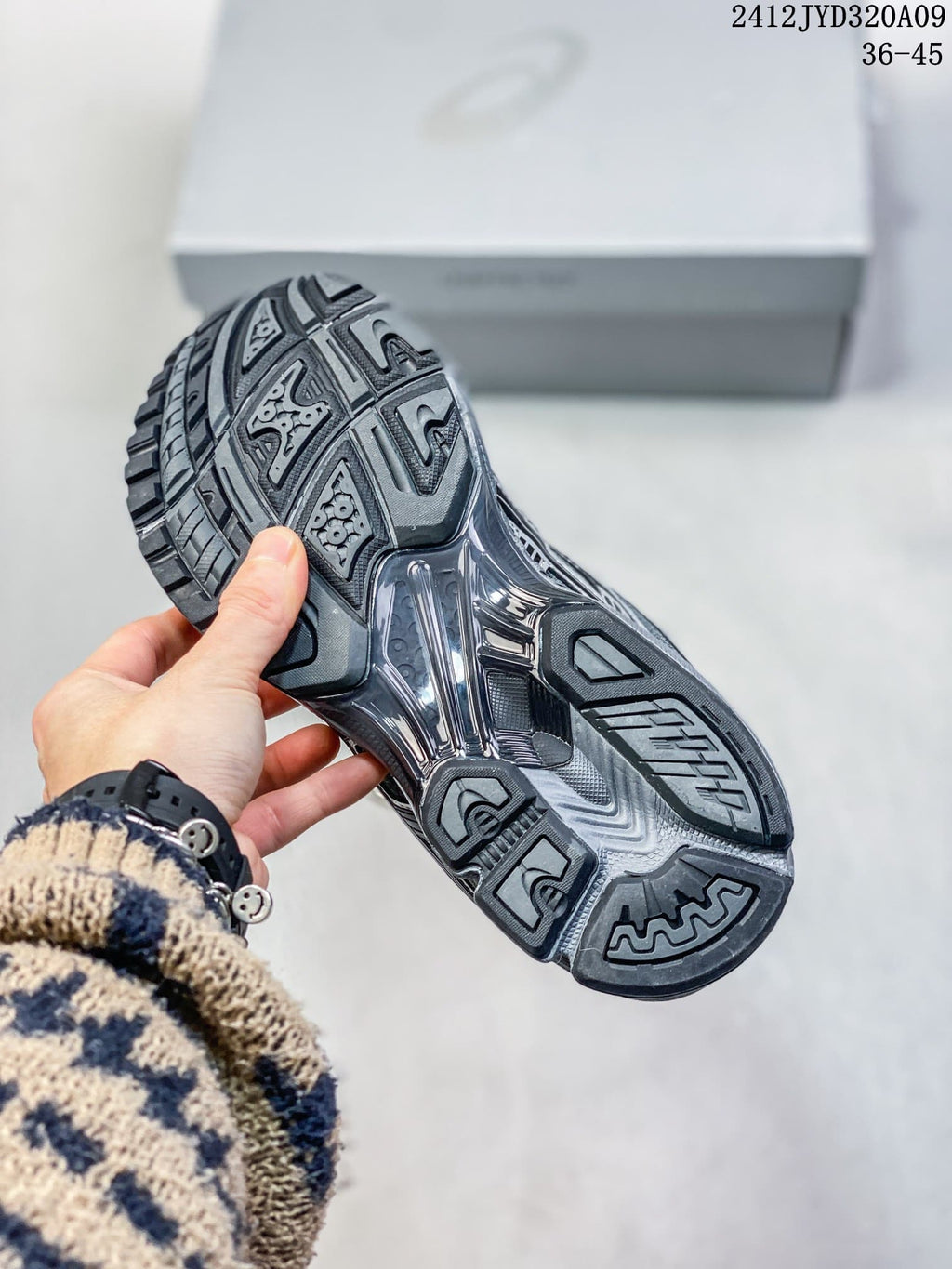 Underside of a gray sneaker showing a patterned outsole; image overlay reads 2412JYD320A09 and 36–45.