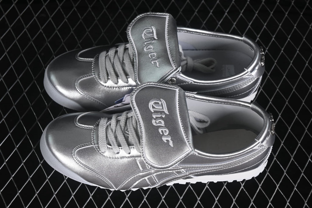 Top angled view of the pair showing the silver finish, laces, padded tongues, and side stripes.