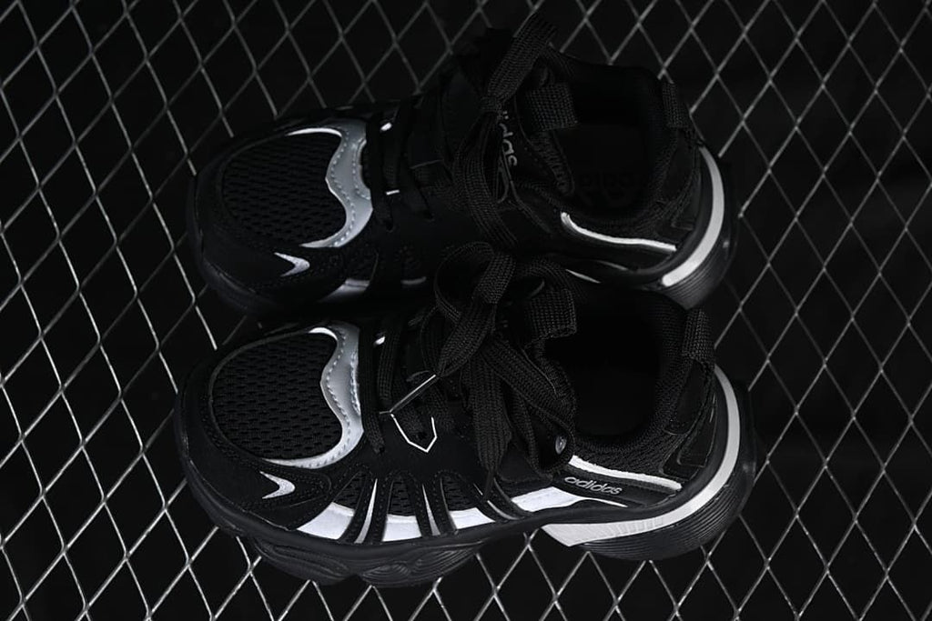 Pair of black and silver sneakers viewed from above