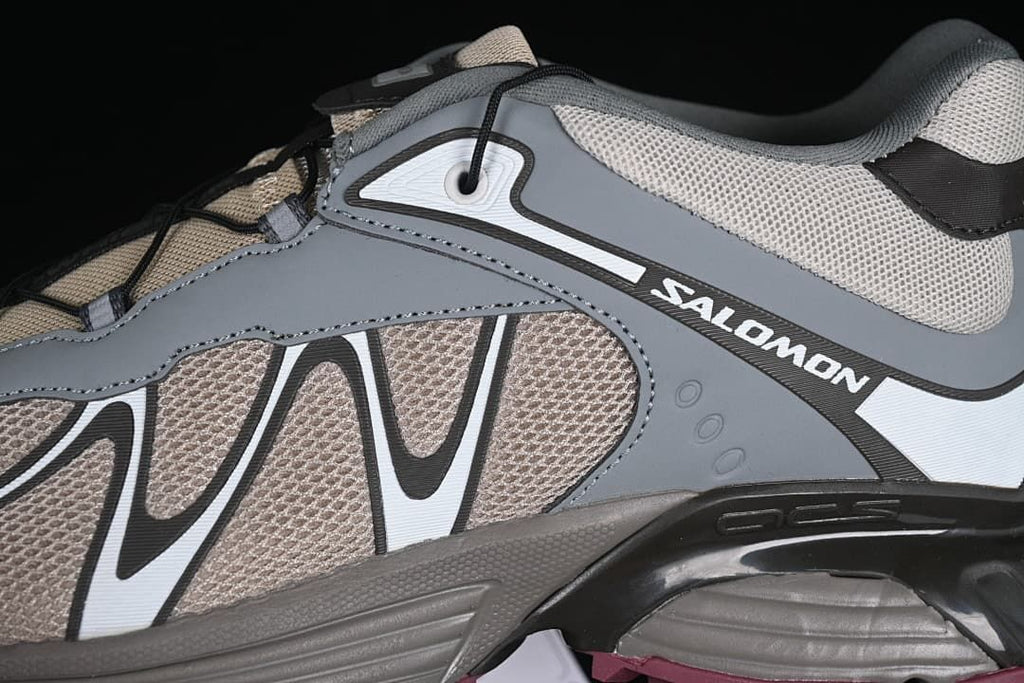 Close-up of the lateral side panels and Salomon branding.