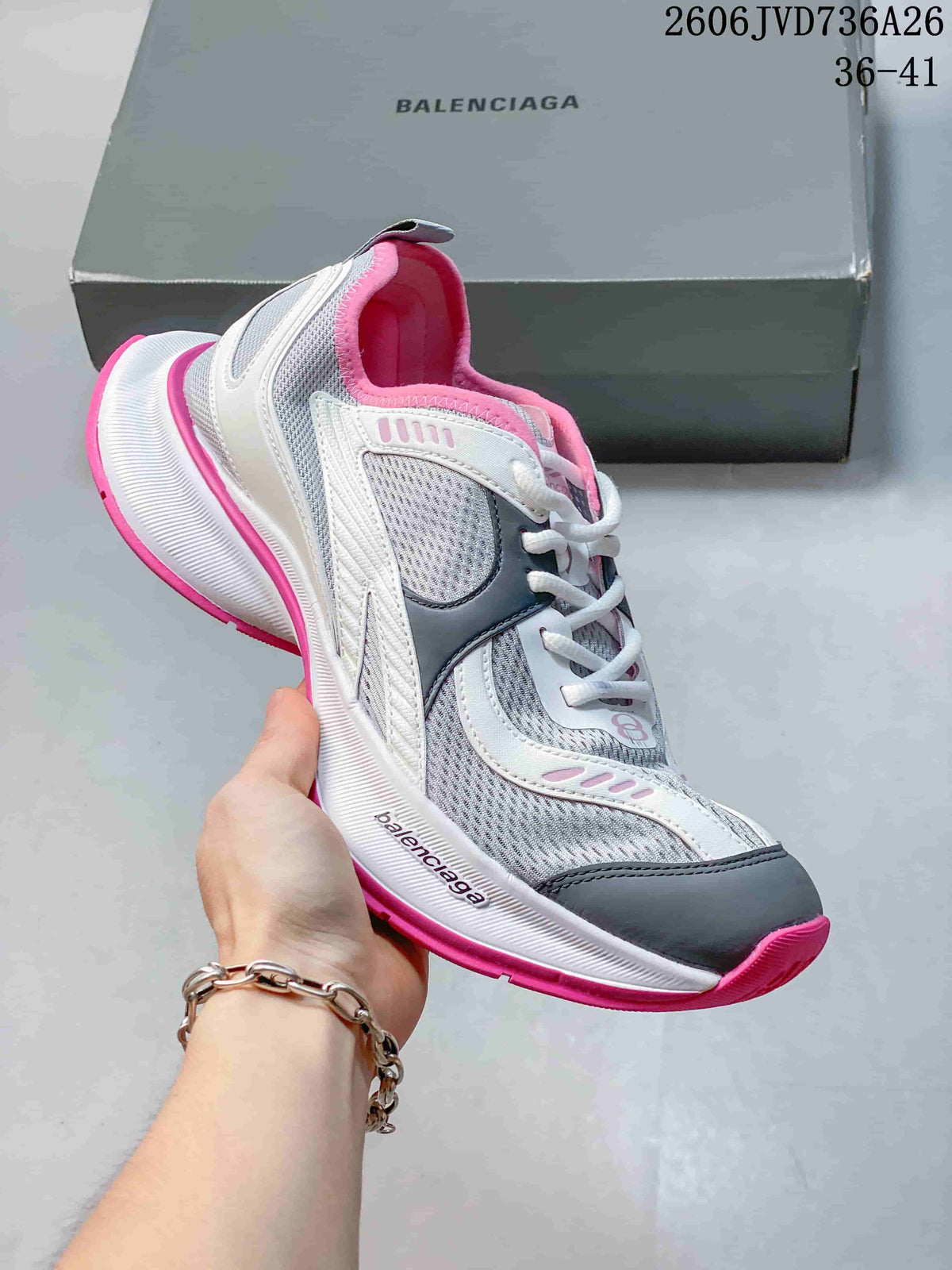 White and gray Balenciaga Circuit-style sneaker with pink accents and a thick sculpted sole