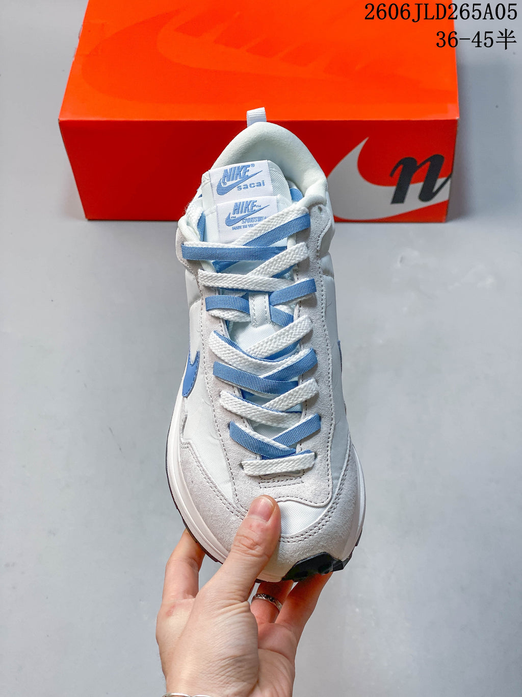 Front view of the Nike Sacai LDWaffle sneaker with overlapping laces