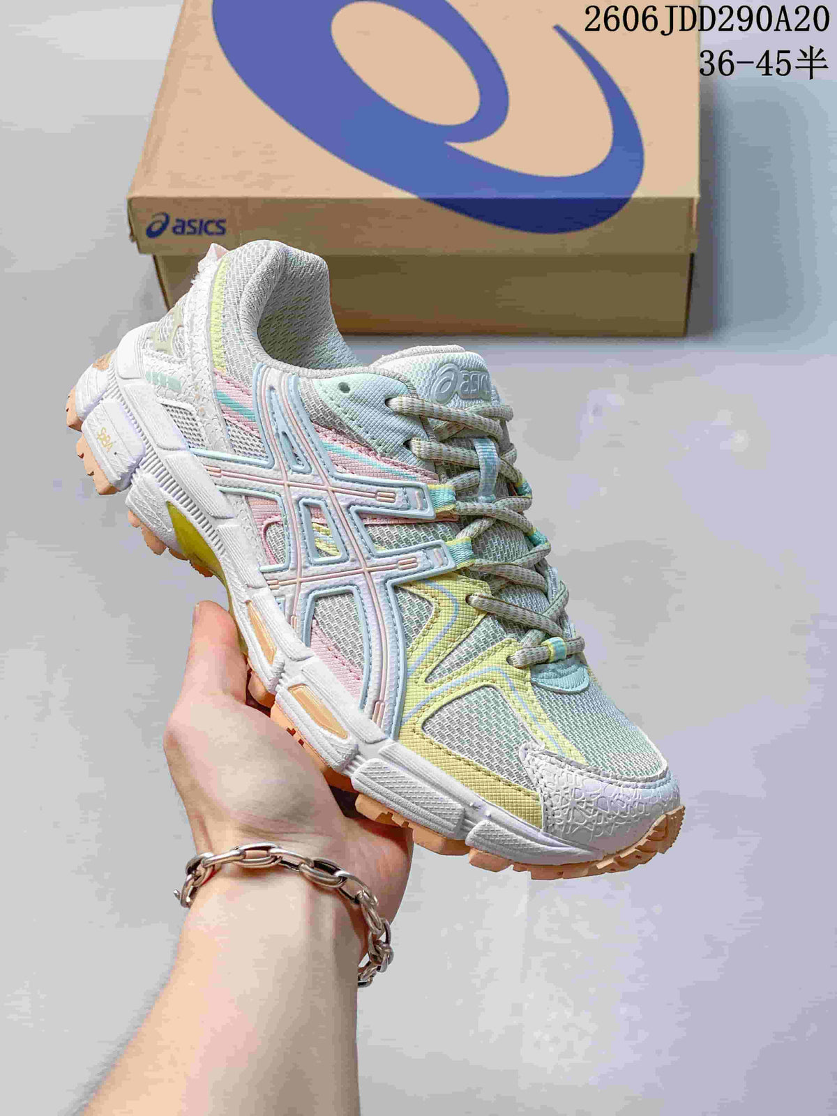 ASICS Gel-Kahana 8 sneaker in pale grey with pastel blue, pink and yellow accents.