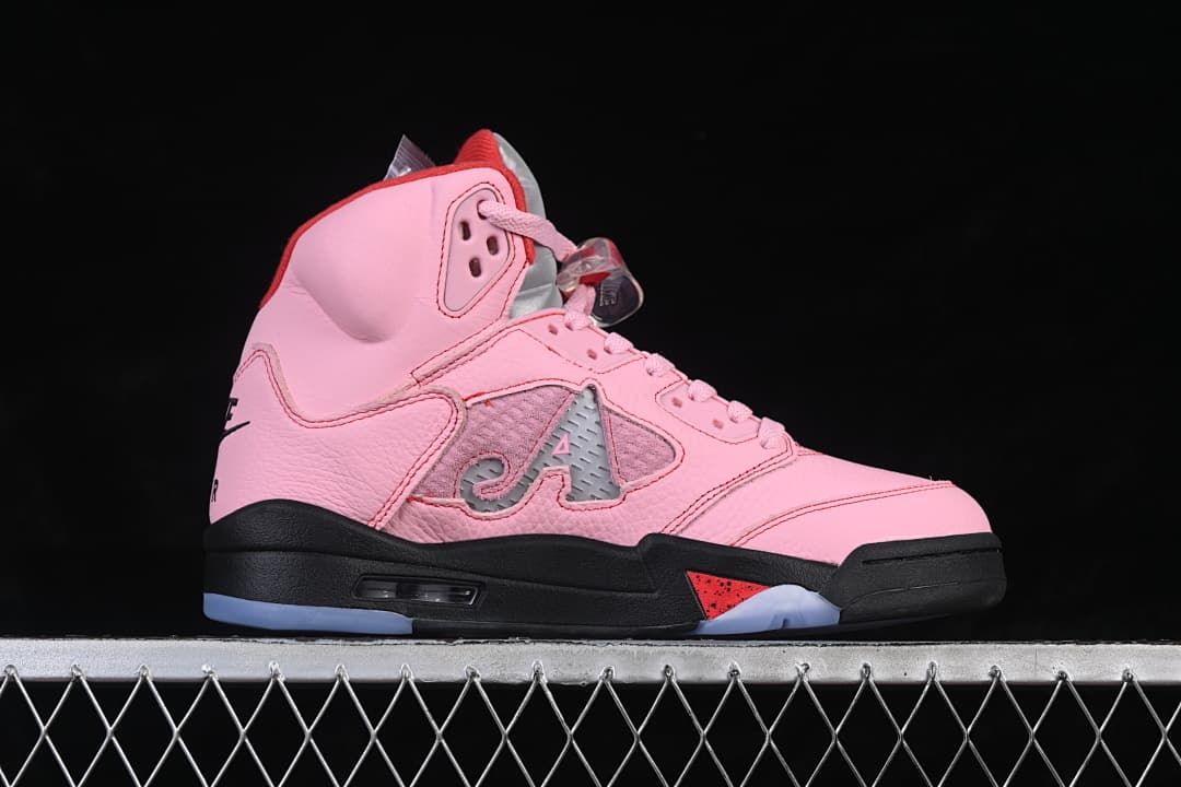 Side profile of the pink high-top sneaker with red and black accents.