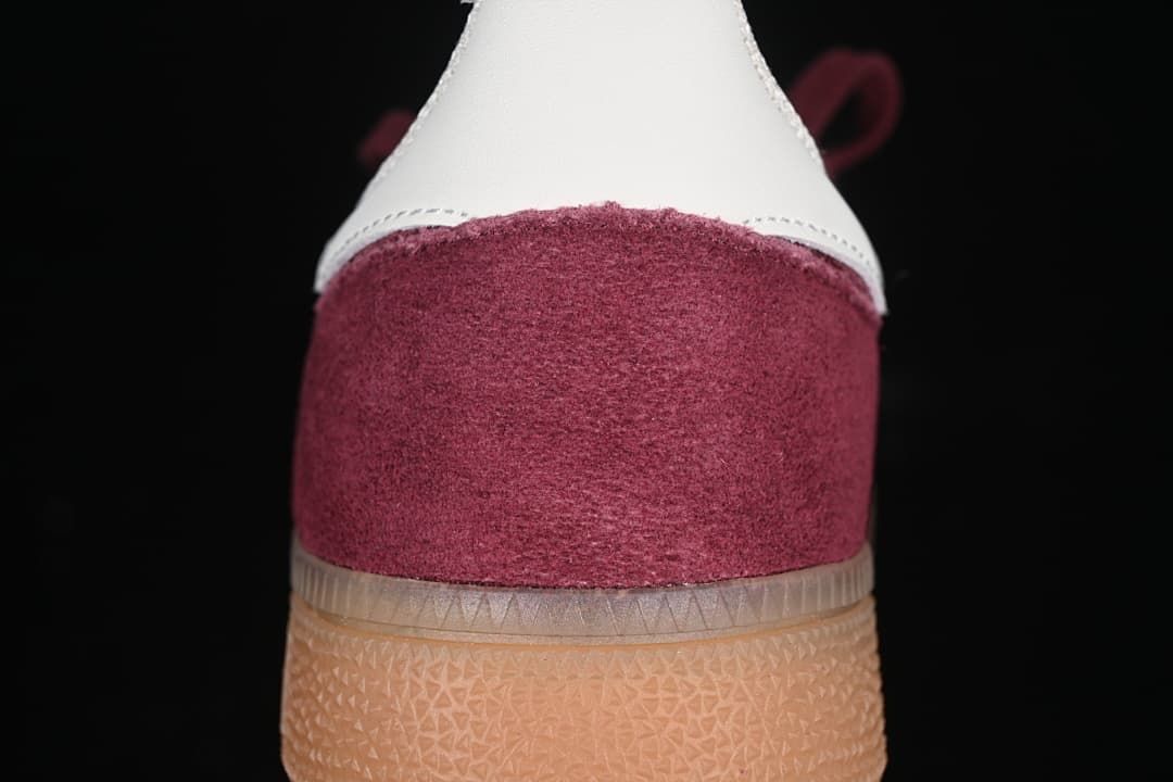 Rear view highlighting the burgundy heel and white heel detail