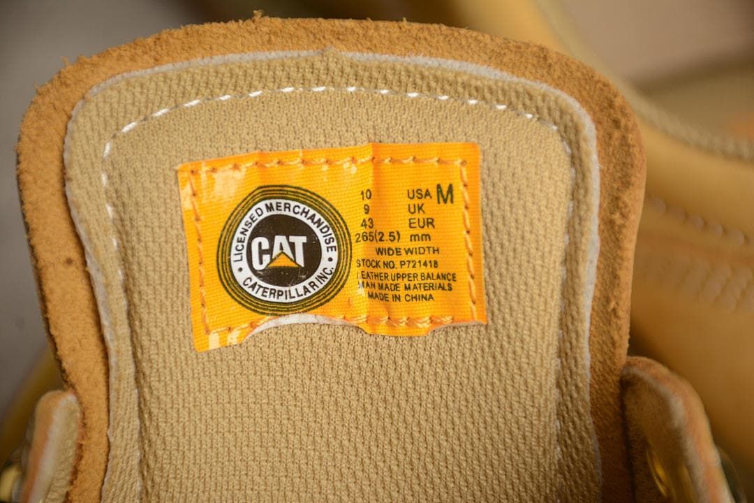 Tongue label showing CAT branding, stock number P721418, and sample size details