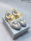 Pair of cream, gray, yellow, and blue GG-CC low-top sneakers shown from above.