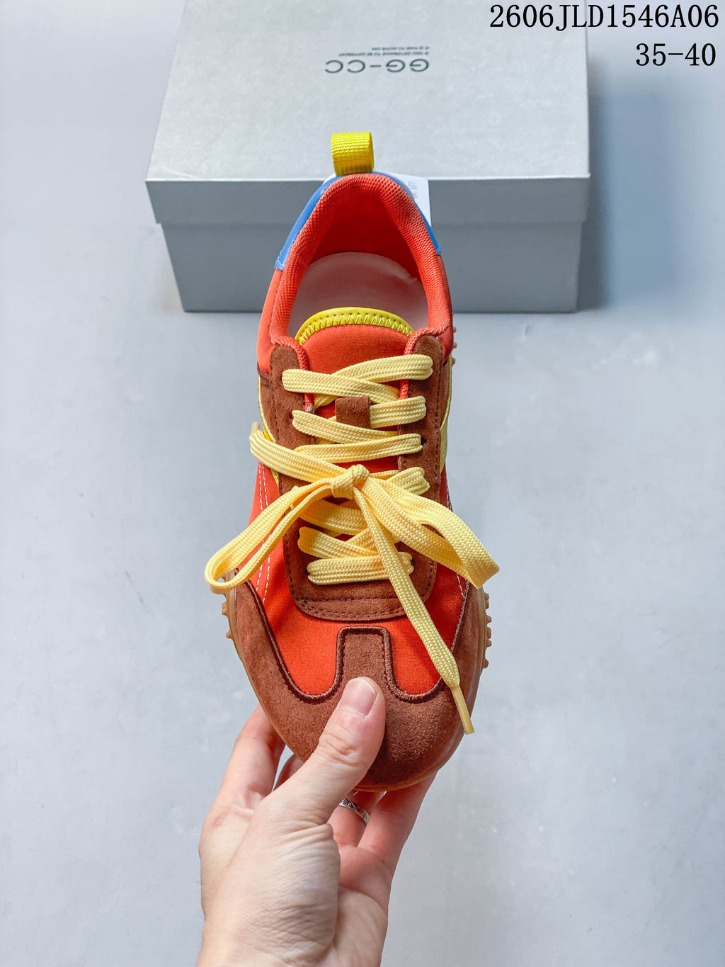 Top view showing yellow laces and the sneaker's T-toe paneling