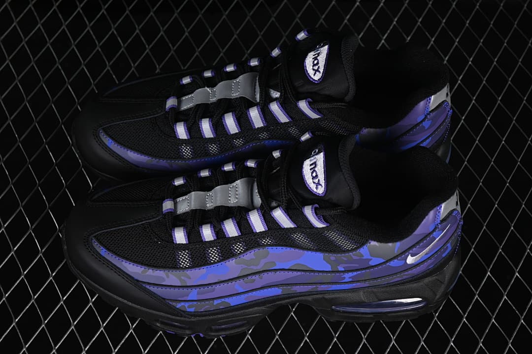 Pair of black, blue, and purple Nike Air Max 95 sneakers viewed from above at an angle