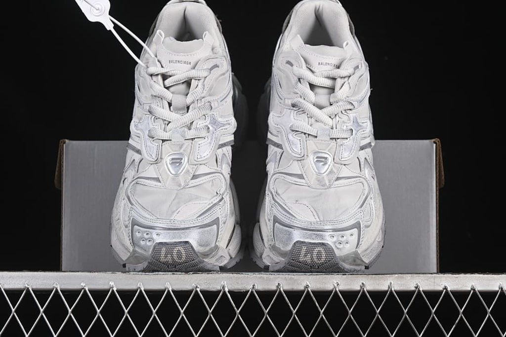 Front view of the pair showing the layered toe and lace-up design.