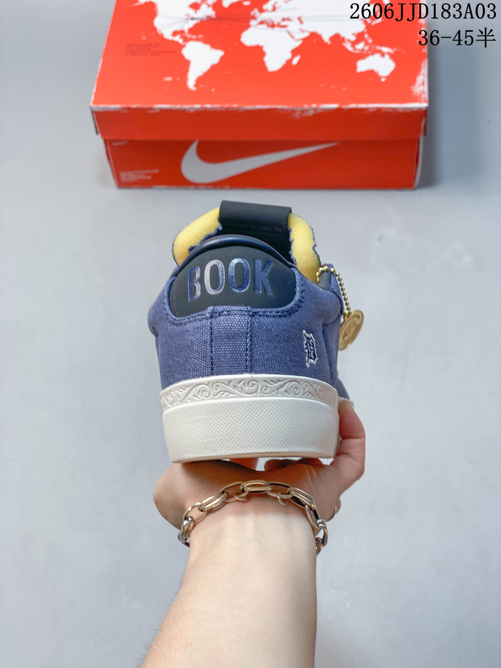 Rear view of the blue sneaker showing the Booker heel detail