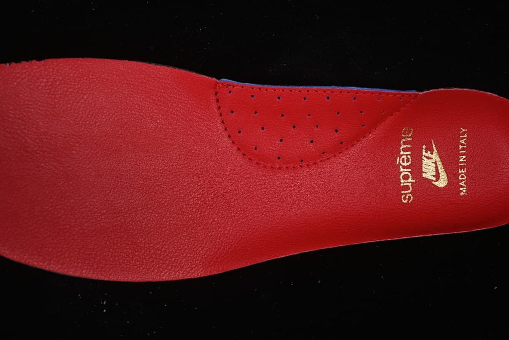 Close-up of the red insole with Supreme and Nike branding