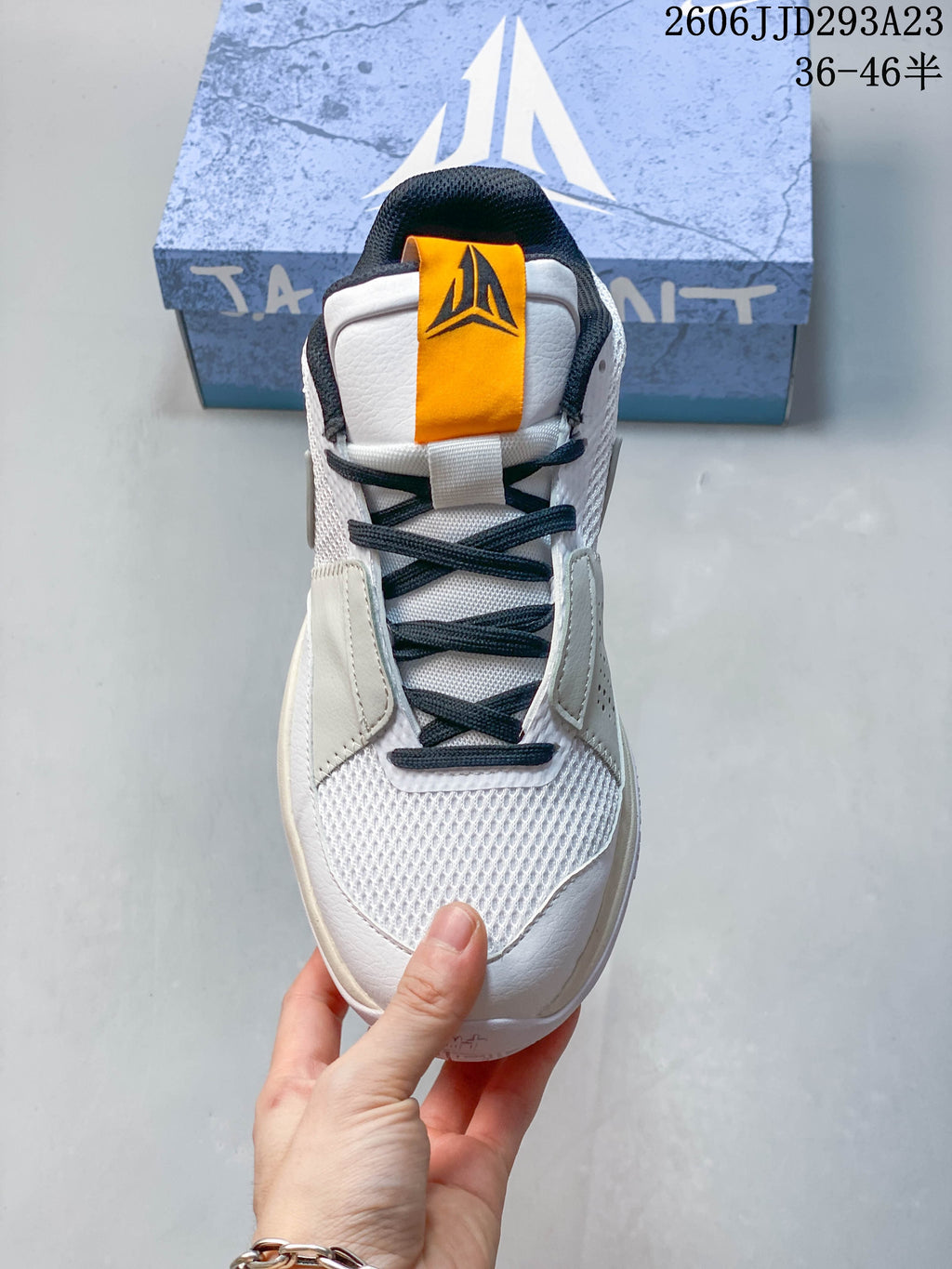Front view showing the laces, tongue detail, and toe of the shoe.