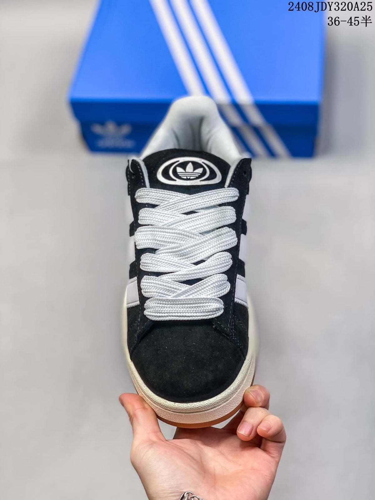 Front view showing the black toe, oversized white laces, and padded tongue.