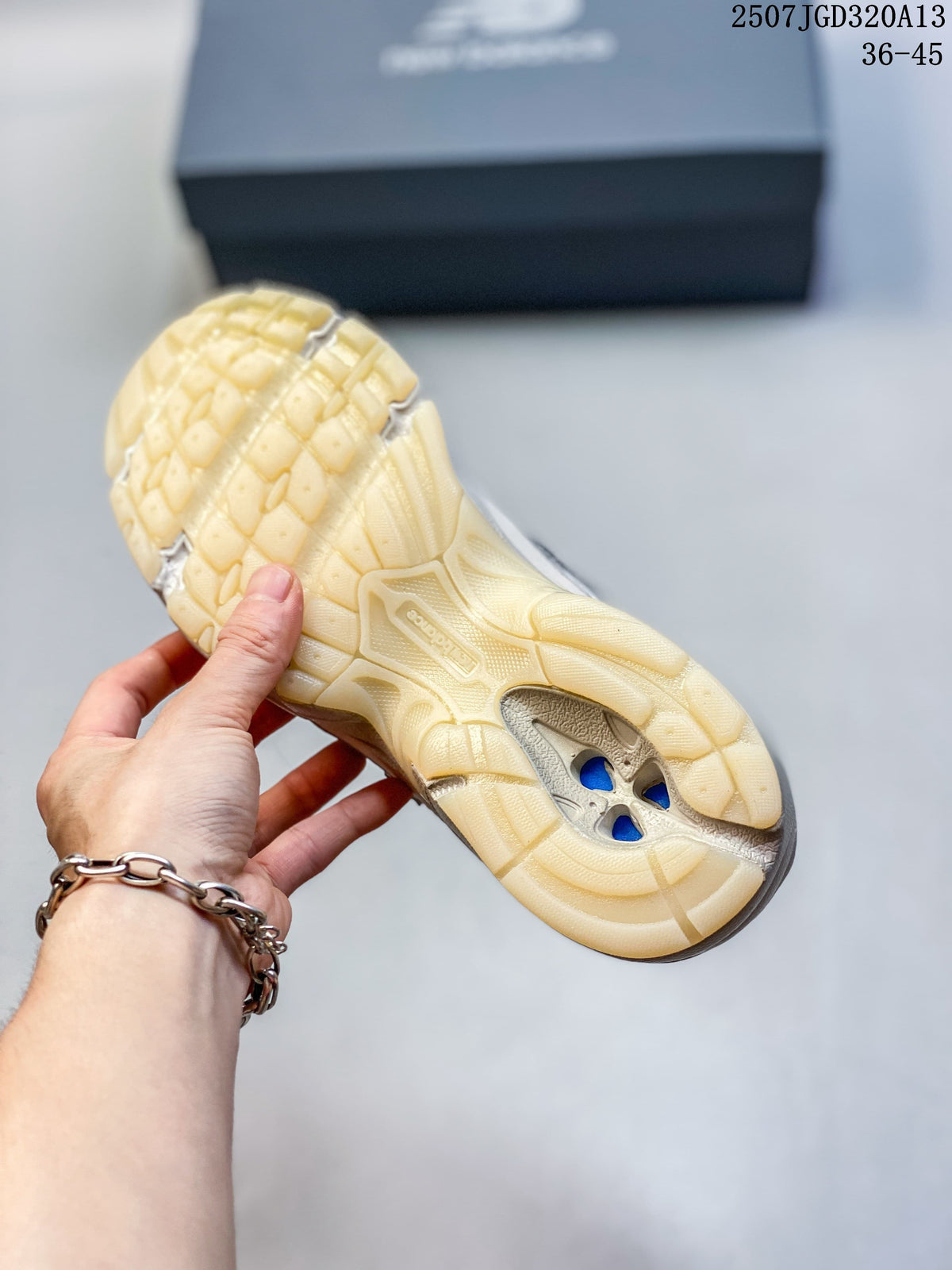 Close-up of the sneaker outsole with segmented tread and central cutouts