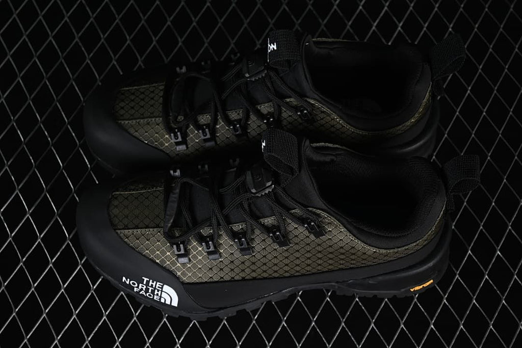 Pair of black and army-green Glenclyffe Low shoes viewed from above