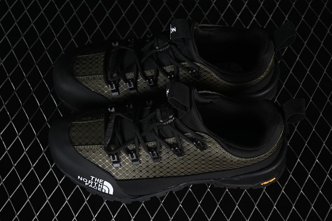 Pair of black and army-green Glenclyffe Low shoes viewed from above