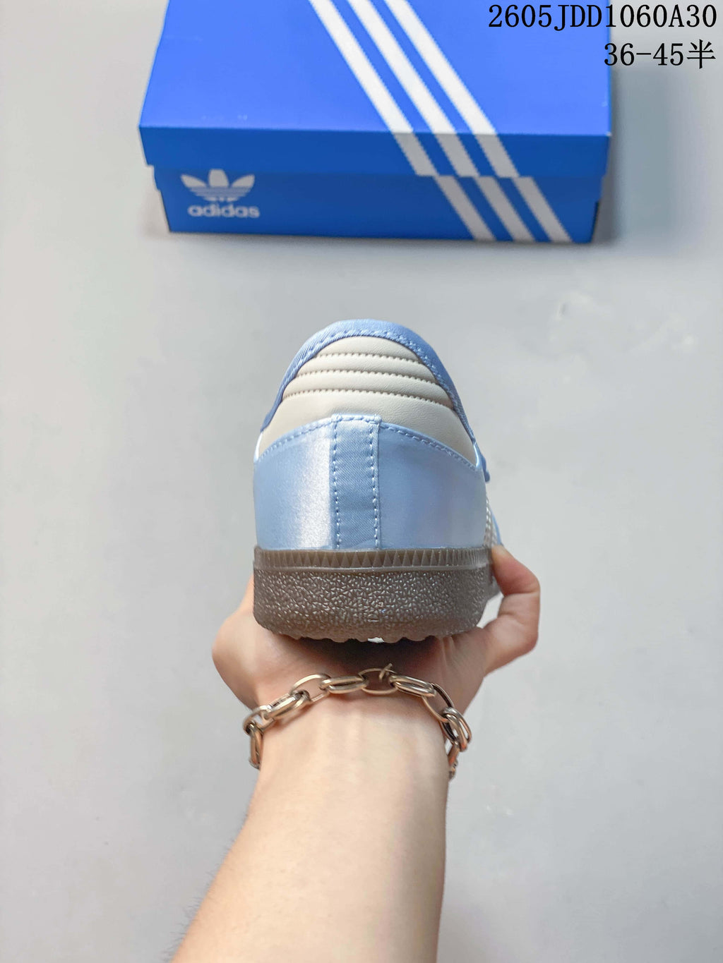 Rear view showing the pale blue heel and light-colored stripe detail