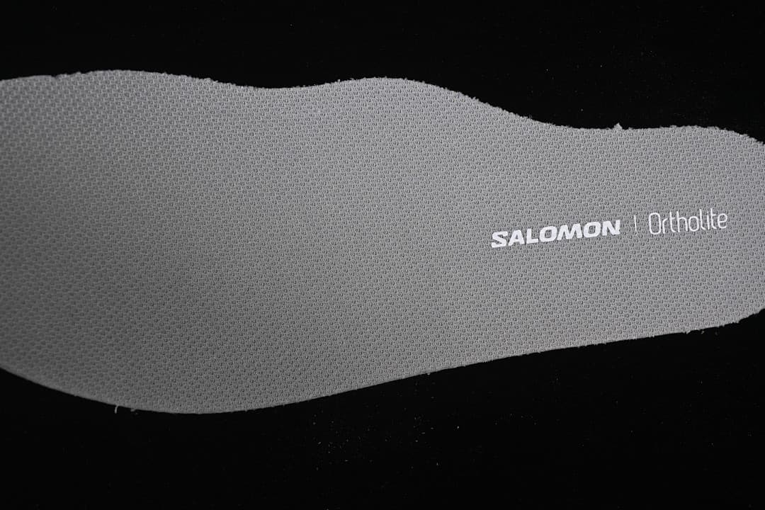 Close-up of the shoe insert marked Salomon and Ortholite.