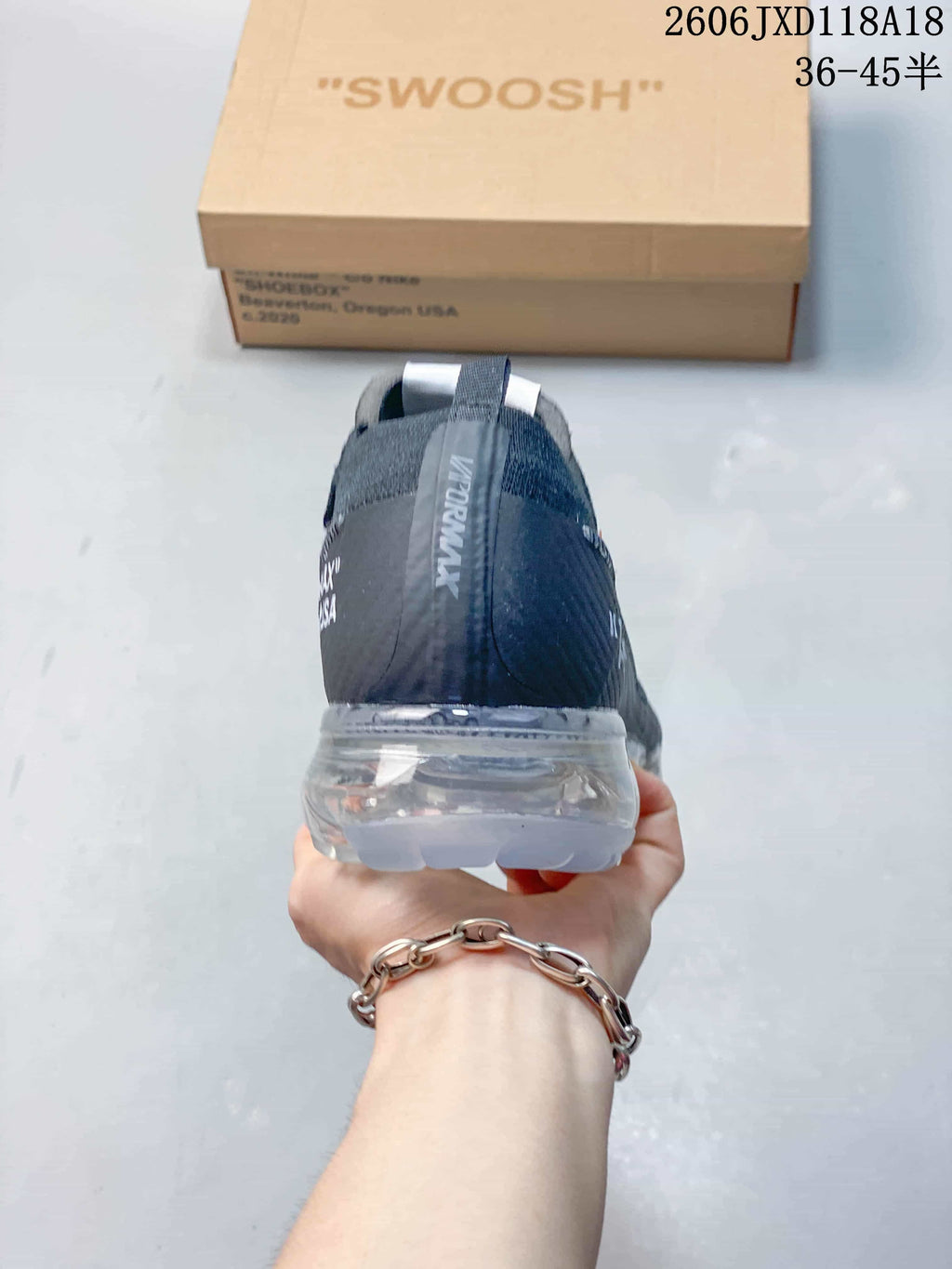 Rear view of the dark grey Nike Air VaporMax sneaker and transparent sole