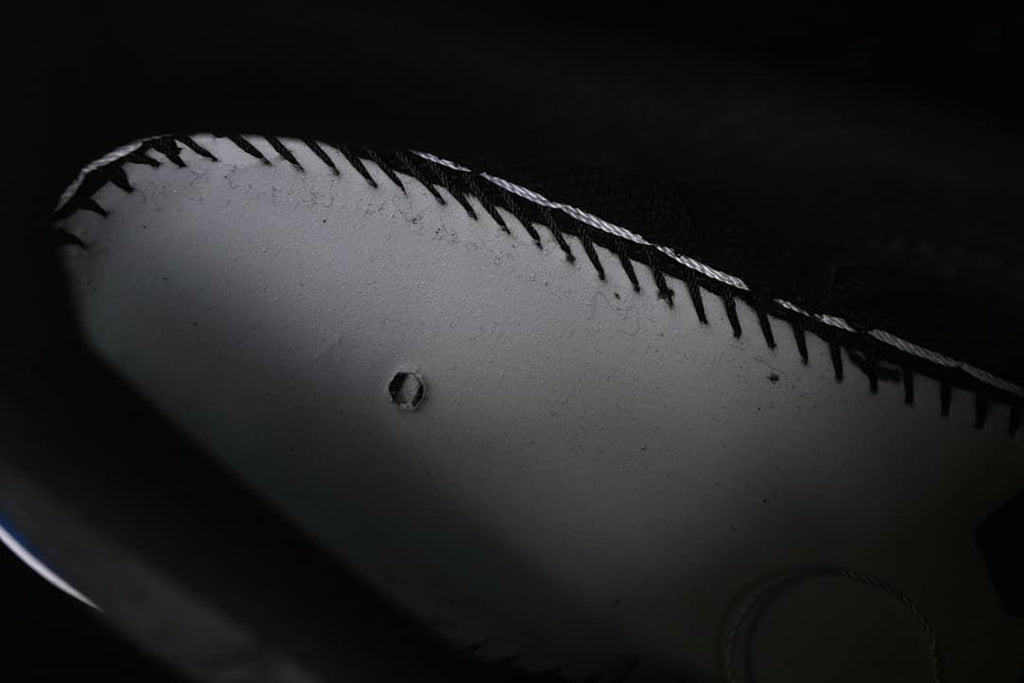 Close-up of stitching along the sneaker upper