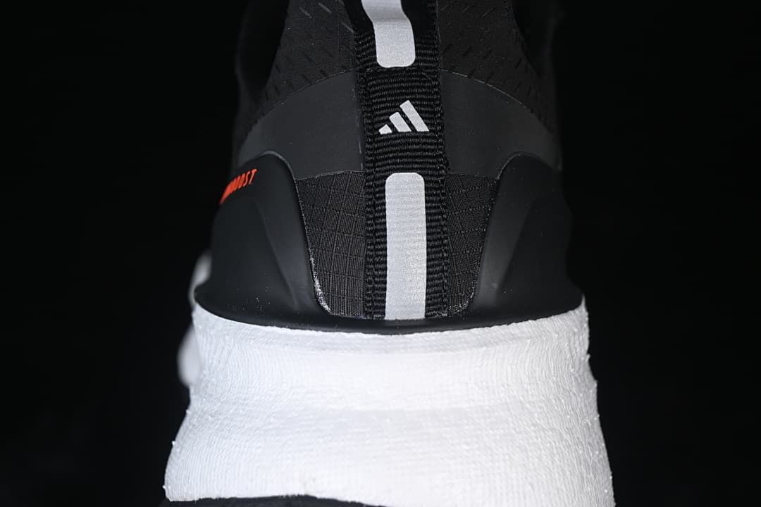 Rear view showing the heel pull tab, adidas logo, and white midsole.