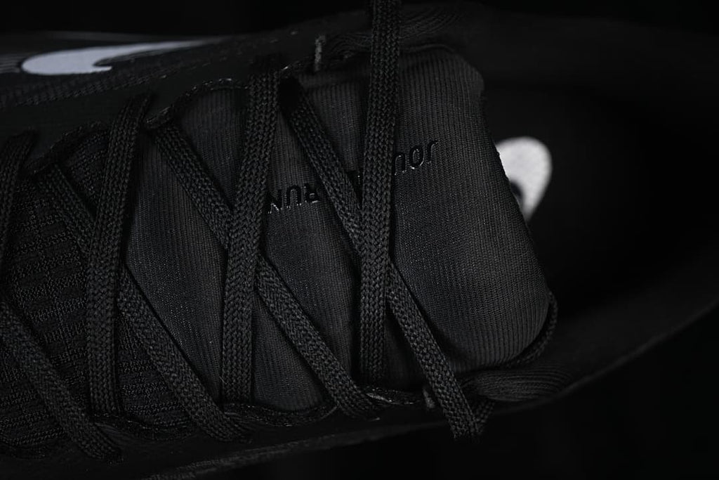 Close-up of black laces and tongue