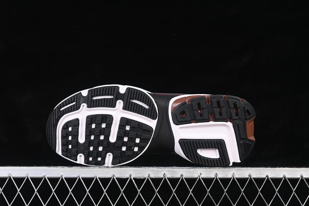 Underside view showing the segmented black, white, and brown outsole