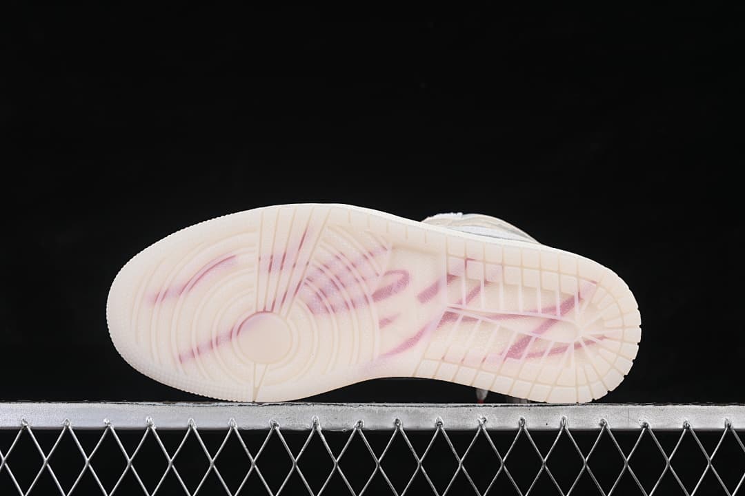 Underside view of the translucent-looking outsole with colored detailing